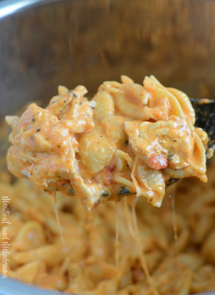 cheesy instant pot creamy chicken pasta on spoon