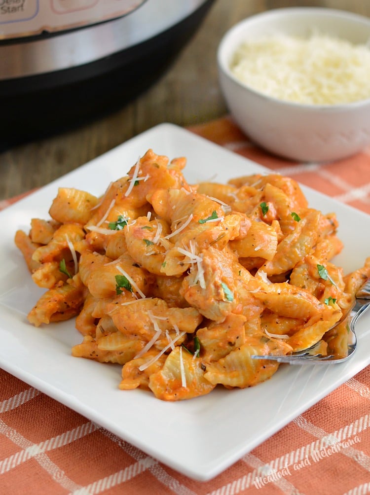 instant pot creamy chicken pasta with parmesan cheese on plate