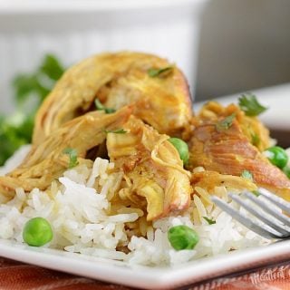 instant pot honey mustard curry chicken over jasmine rice on a plate