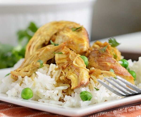 instant pot honey mustard curry chicken over jasmine rice on a plate