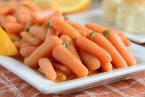 instant pot orange ginger carrots on white platter