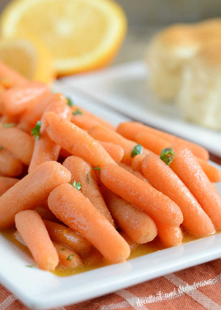 instant pot orange ginger carrots with parsley on white platter