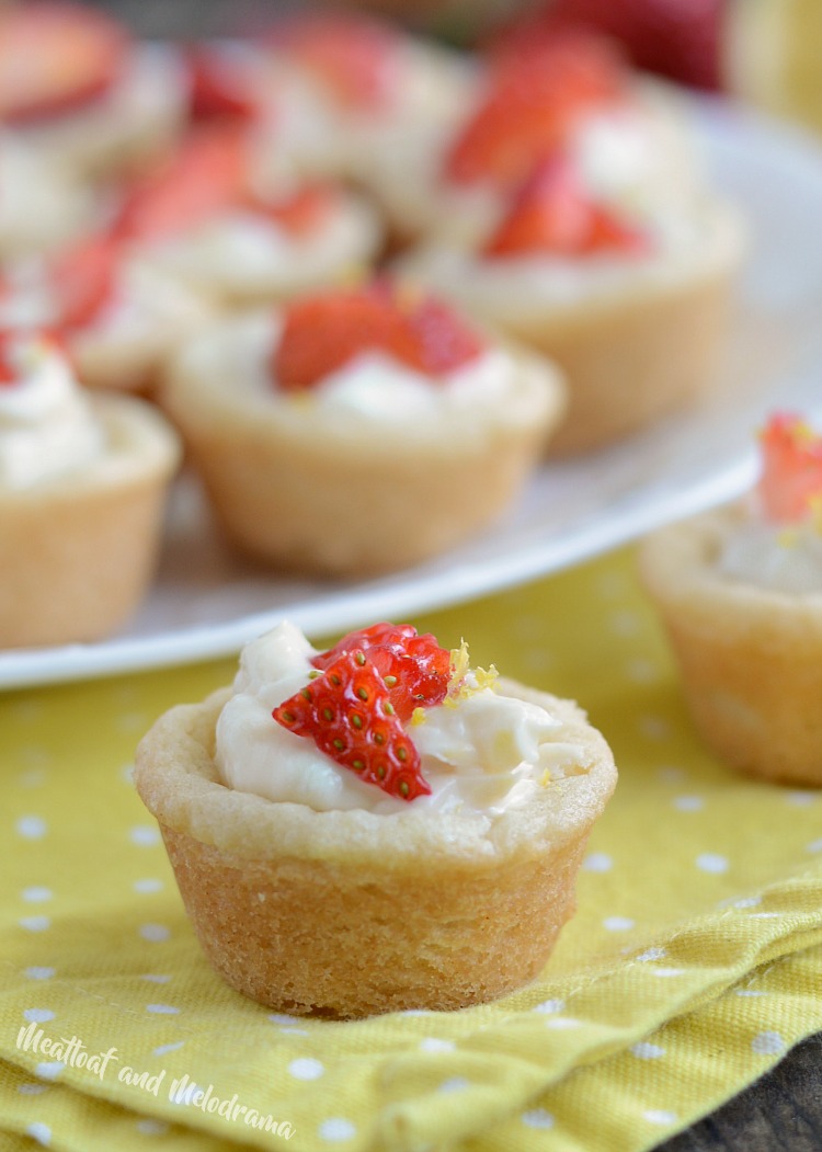 lemon cheesecake cookie cups with strawberries and lemon zest