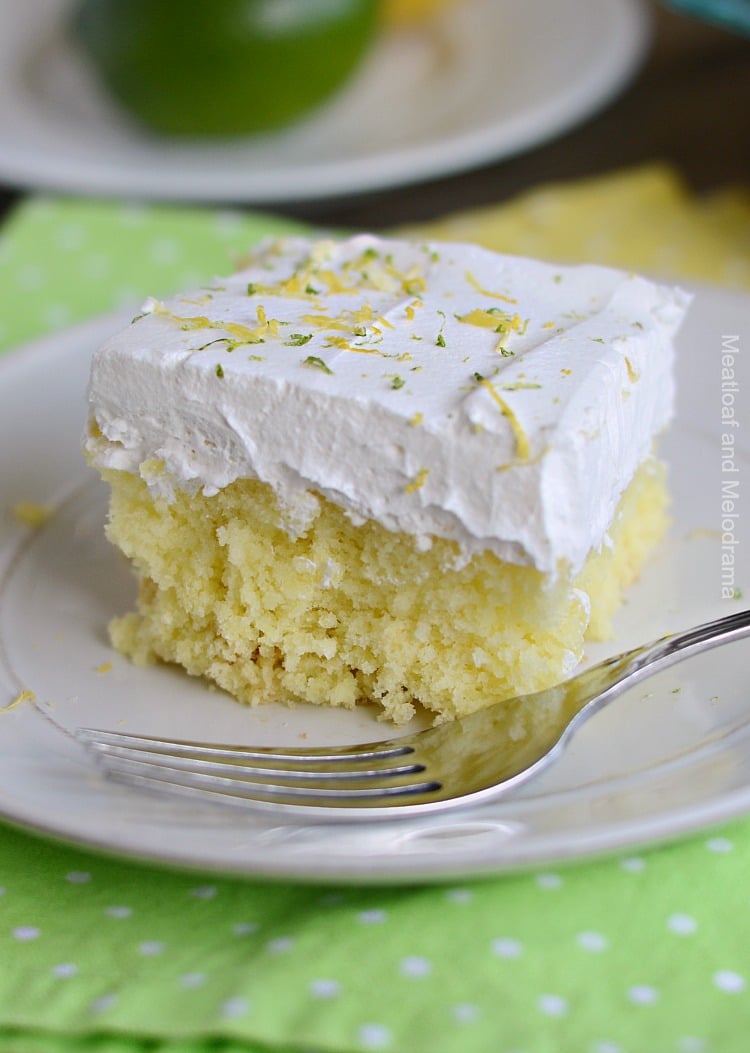 lemon lime soda cake with whipped topping on plate
