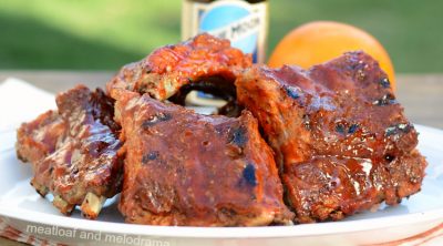 instant pot beer ribs with orange valencia beer on a platter