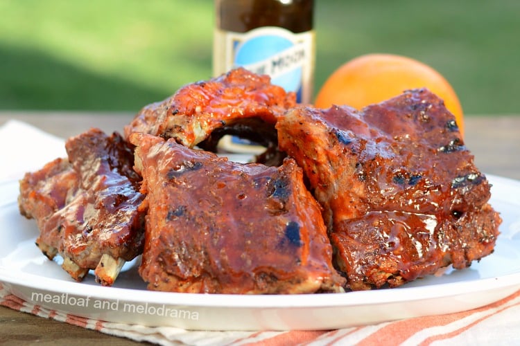 instant pot beer ribs with orange valencia beer on a platter