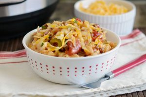 instant pot macaroni beef casserole with cheese in white bowl