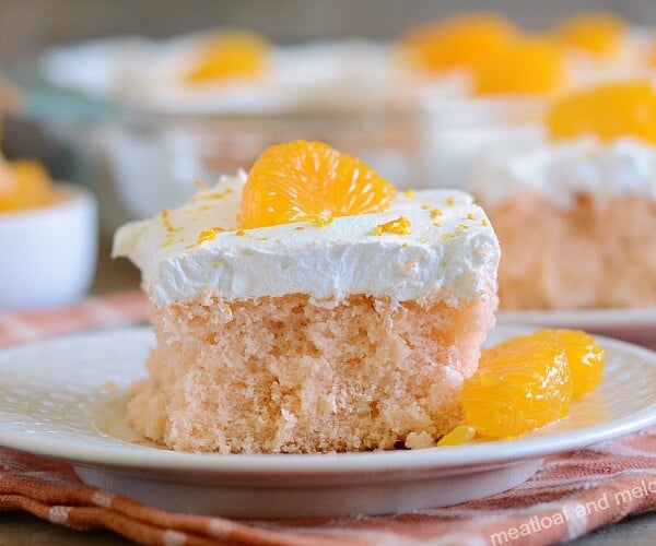 orange crush soda pop cake with cool whip frosting and mandarin orange slices