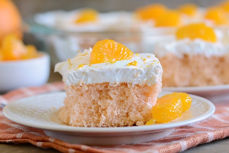 orange crush soda pop cake with cool whip frosting and mandarin orange slices
