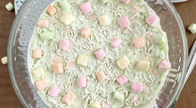 bowl of pistachio watergate salad with pastel marshmallows