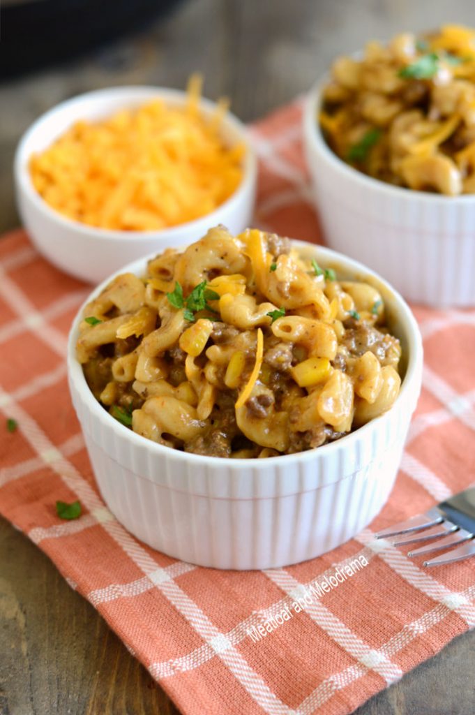 instant pot bbq macaroni and beef with cheddar cheese and corn in dish