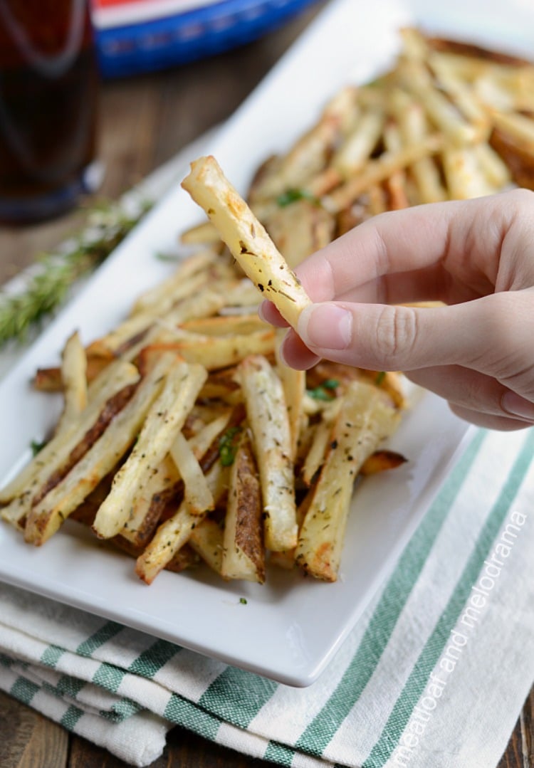 homemade baked french fries in hand