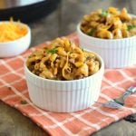 instant pot bbq macaroni and beef with cheddar cheese in white bowls