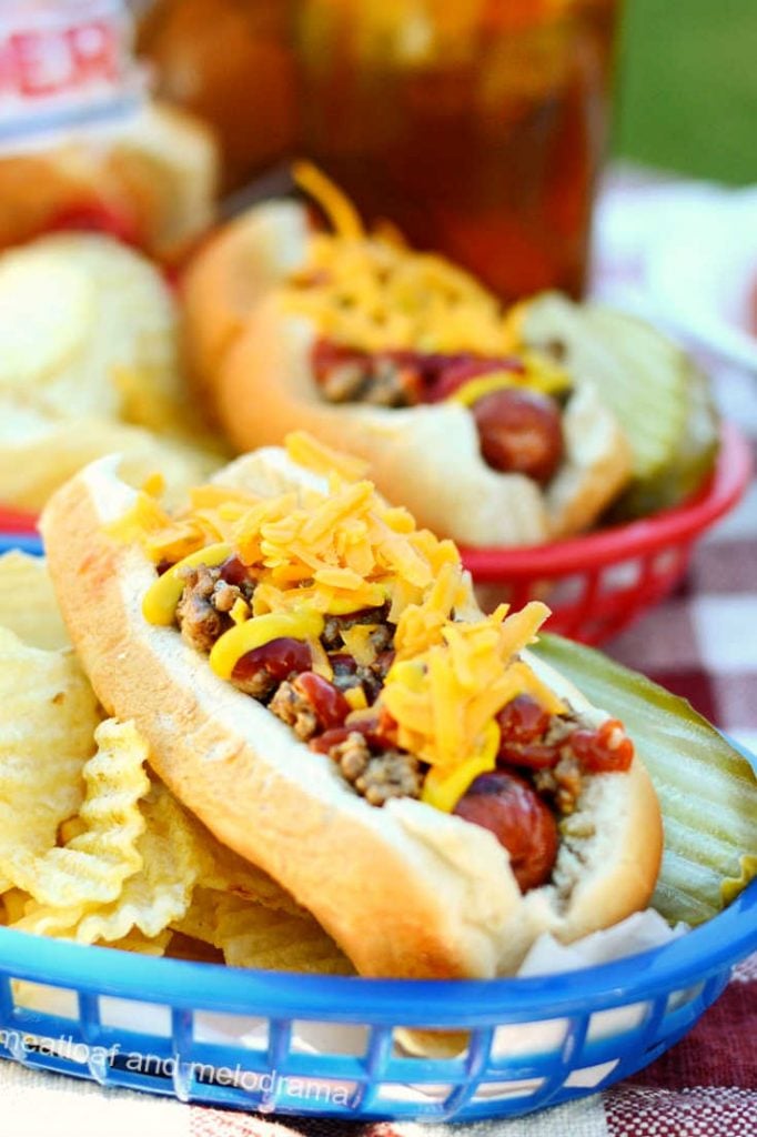 hot dog with meat and cheese on top