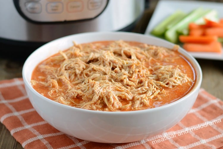 instant pot buffalo chicken recipe shredded in white bowl