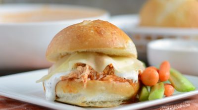 instant pot buffalo chicken sliders with ranch and provolone cheese on plate