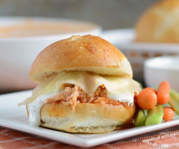 instant pot buffalo chicken sliders with ranch and provolone cheese on plate