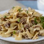 instant pot ground beef stroganoff on white plate with parsley