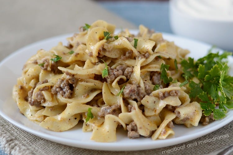 instant pot ground beef stroganoff on white plate with parsley