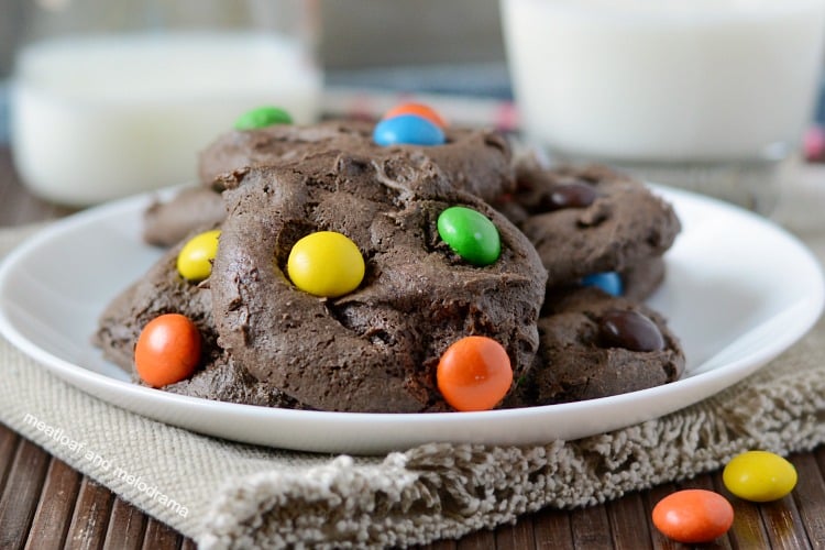 chocolate cake mix cookies with peanut butter candies on white plate