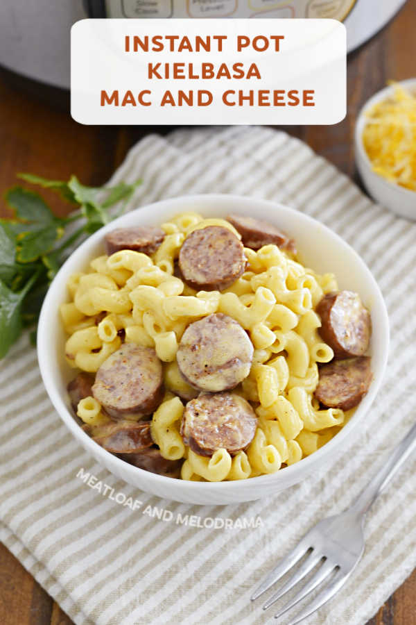 close up of mac and cheese with kielbasa in bowl