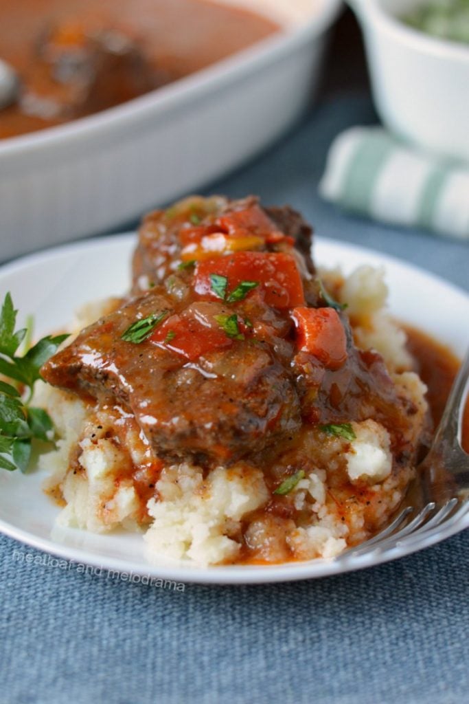 instant pot swiss steak with tomato beef sauce on plate