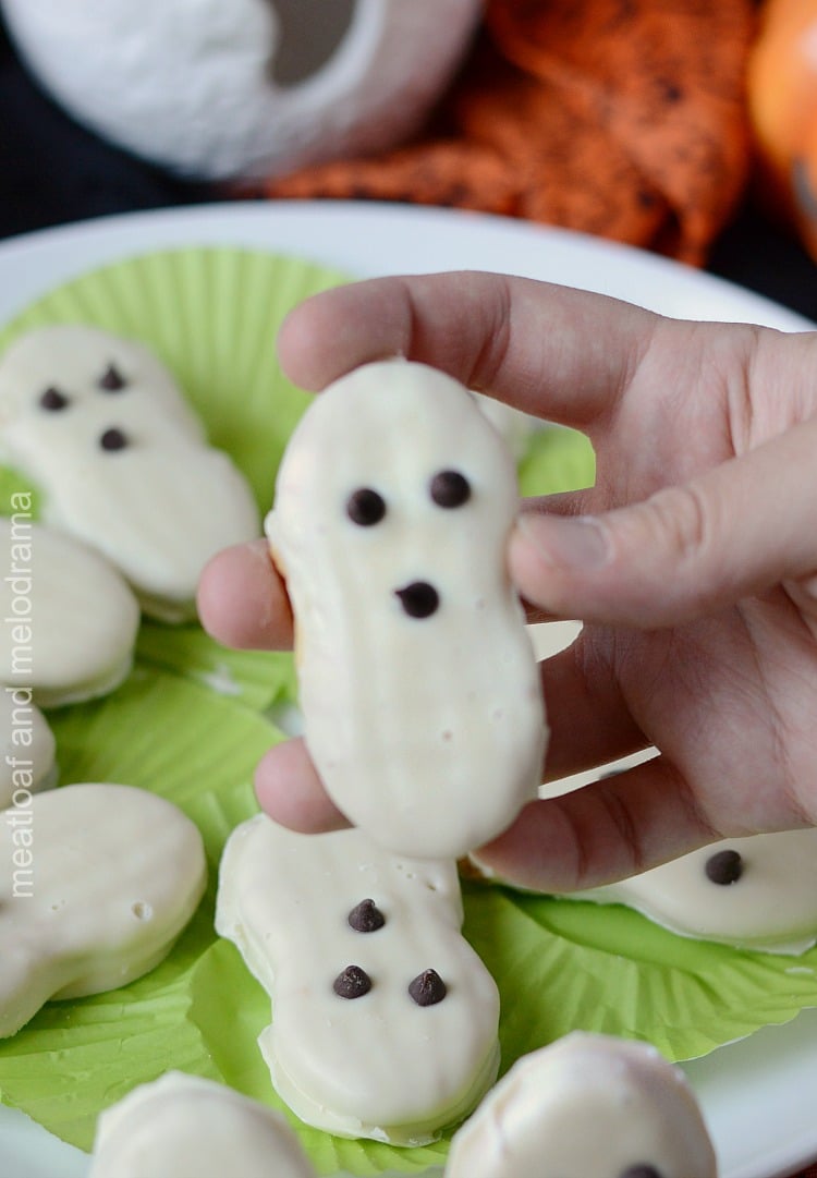 hand holding easy halloween ghost cookies