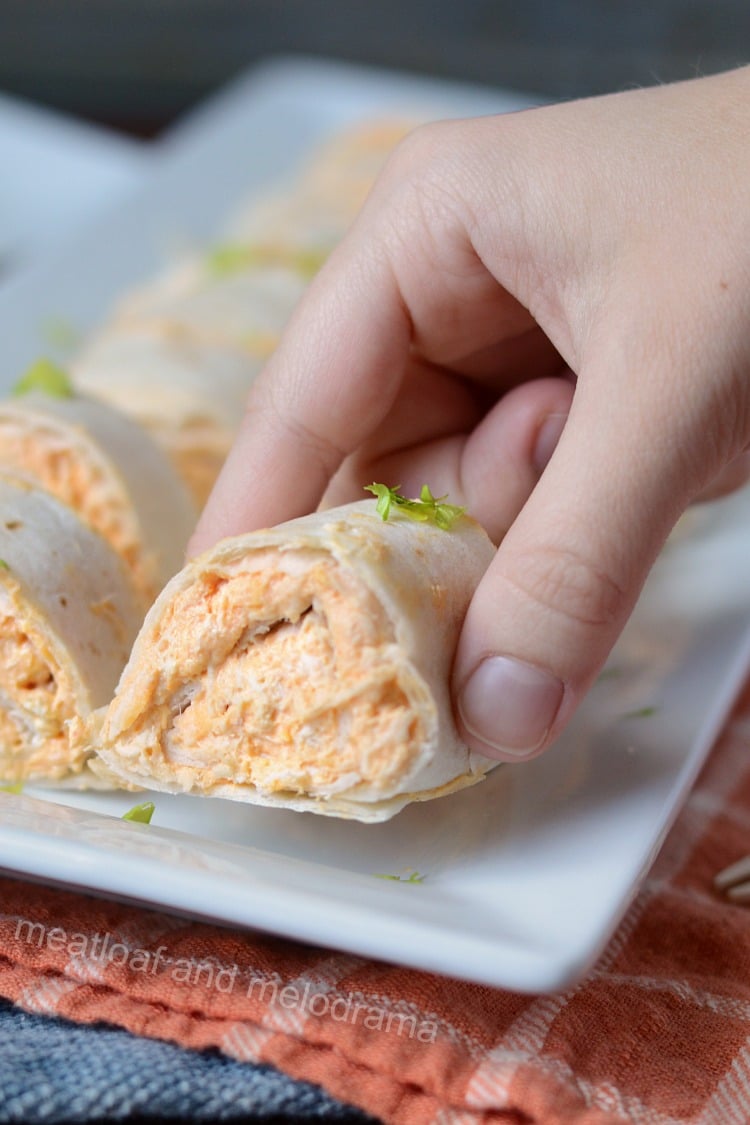 instant pot buffalo chicken roll ups in hand