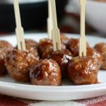 instant pot cranberry orange meatballs on plate with toothpick skewers