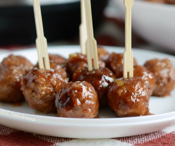 instant pot cranberry orange meatballs on plate with toothpick skewers