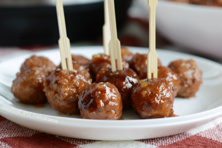 instant pot cranberry orange meatballs on plate with toothpick skewers
