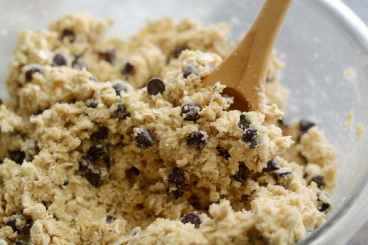 mix chocolate chips into oat cookie dough