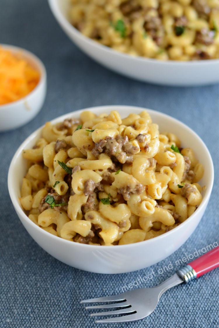 instant pot cheeseburger macaroni in white bowl with parsley