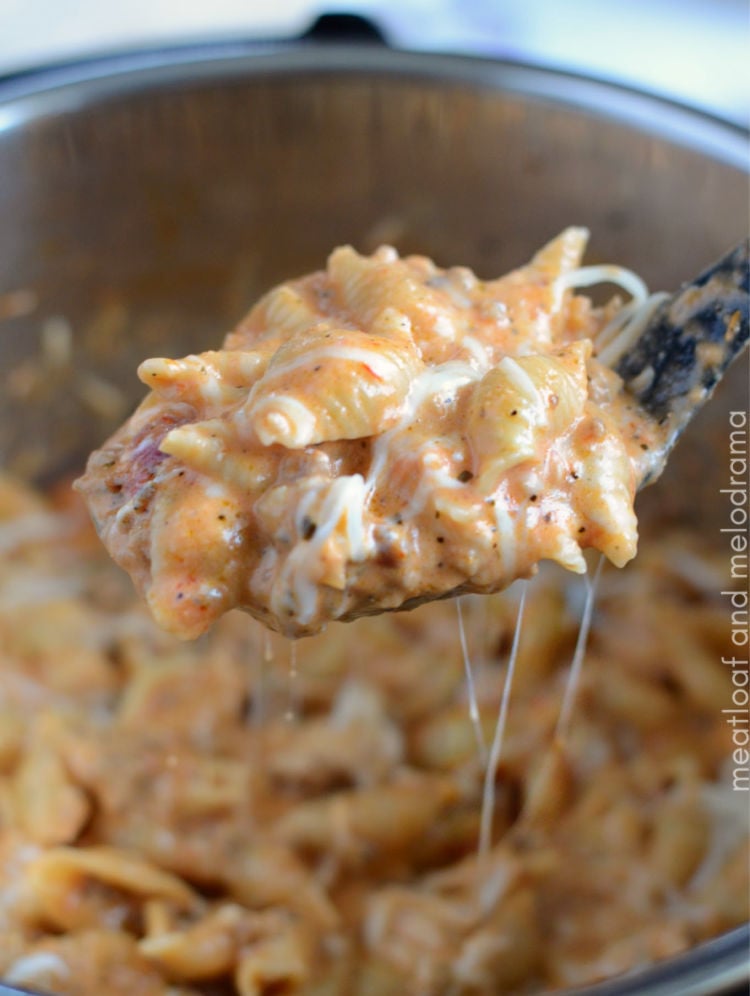 instant pot creamy sausage and shells on spoon