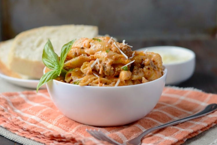 Instant Pot creamy sausage and shells pasta in a white serving bowl