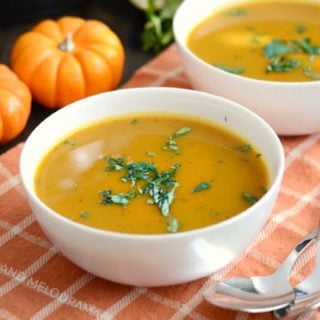 instant pot easy pumpkin soup in white bowls with parsley