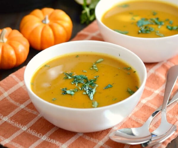 instant pot easy pumpkin soup in white bowls with parsley