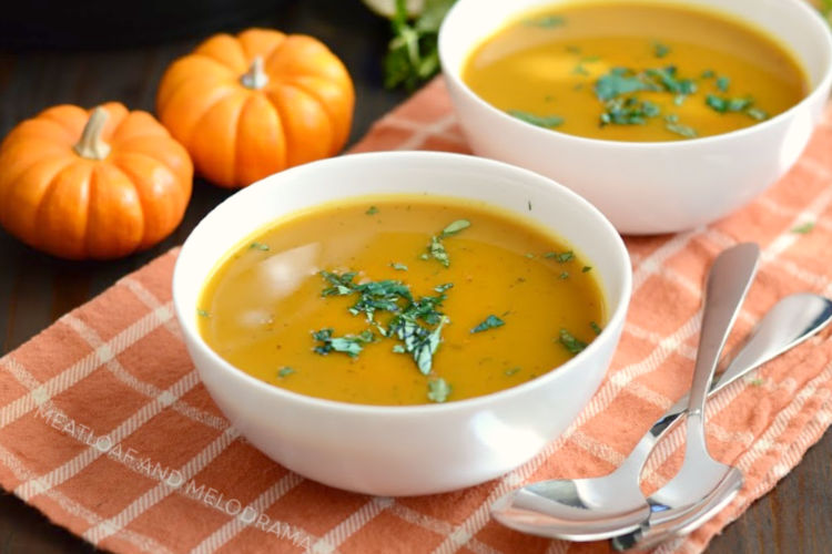 instant pot easy pumpkin soup in white bowls with parsley