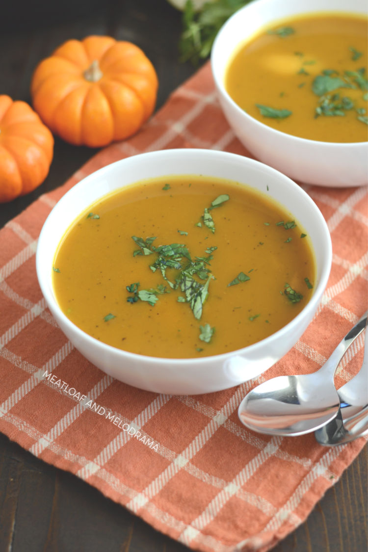 2 bowls of pressure cooker pumpkin soup on the table
