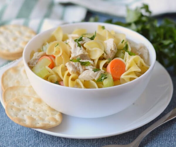 Instant pot turkey soup with noodles in a white bowl