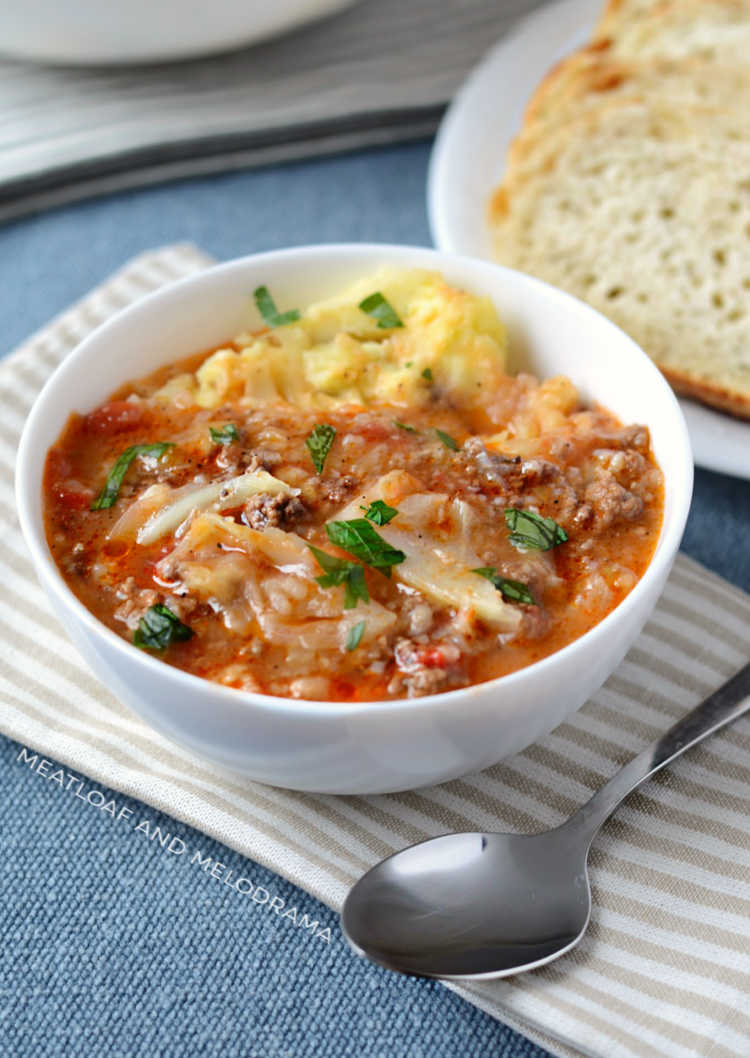 instant pot cabbage roll soup in white bowl with parsley