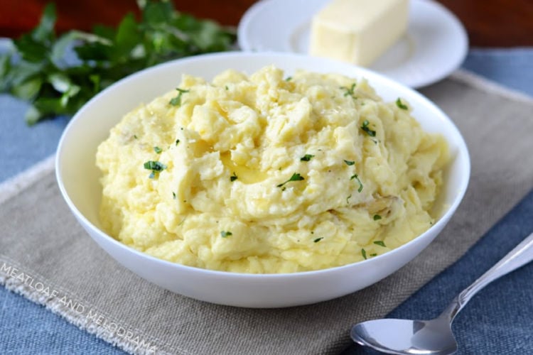 instant pot mashed potatoes with butter in a white bowl