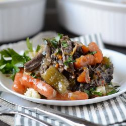 instant pot pot roast with carrots and mashed potatoes on plate
