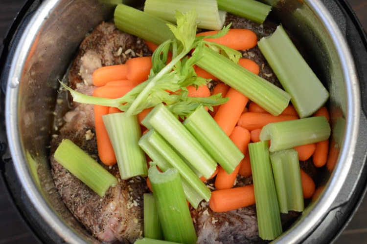add carrots and celery over chuck roast in instant pot