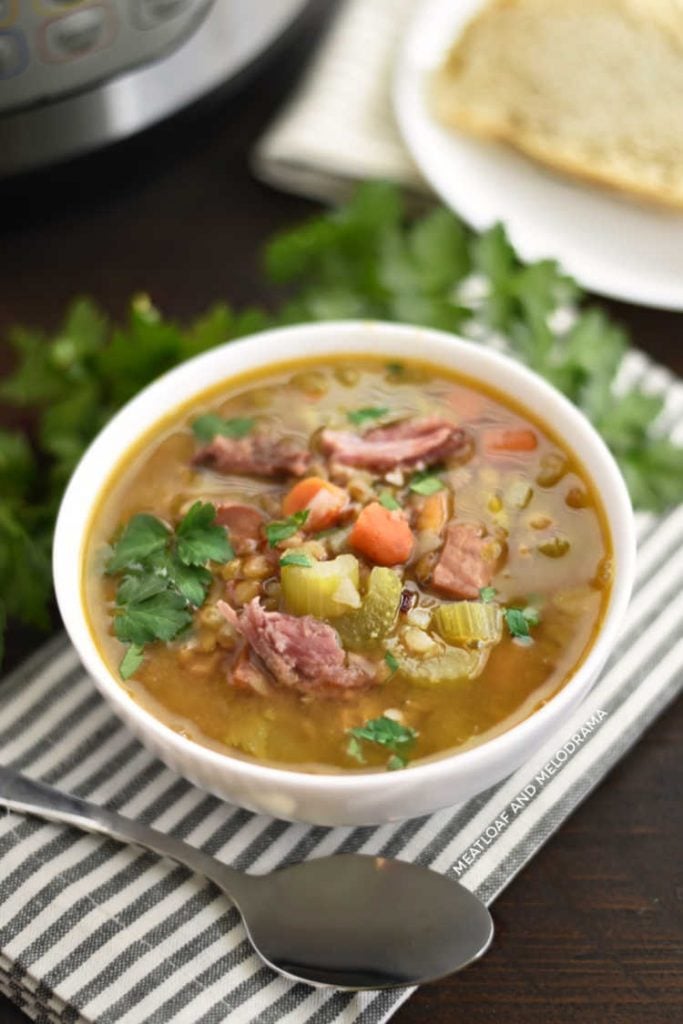 instant pot ham and lentil soup with carrots and celery in white bowl