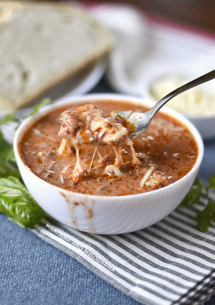 instant pot lasagna soup with stretchy cheese on a spoon