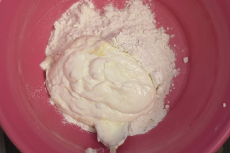 mix greek yogurt and flour in bowl for 2 ingredient bagels