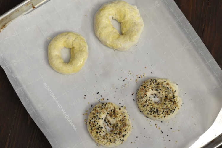 2 ingredient bagels on a baking sheet with parchment paper