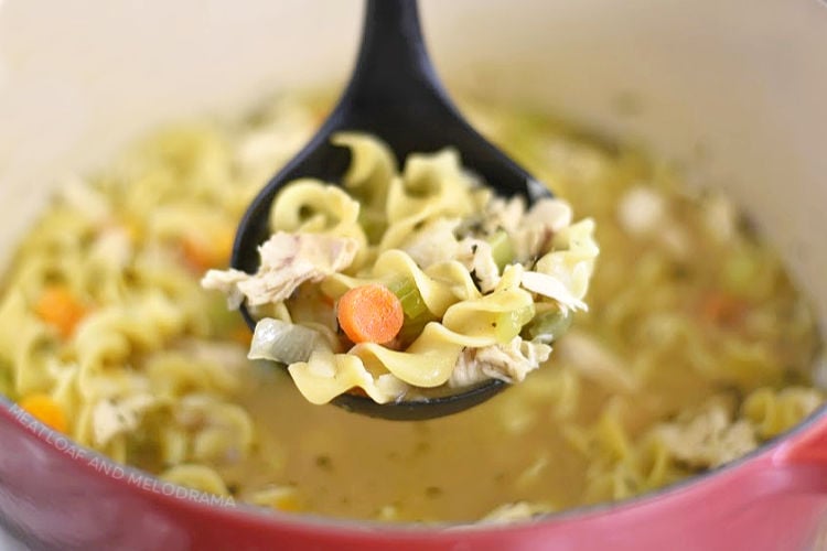 homemade chicken noodle soup in ladle