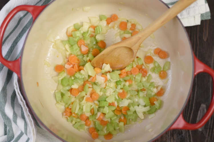 saute onions carrots and celery for homemade chicken soup 
